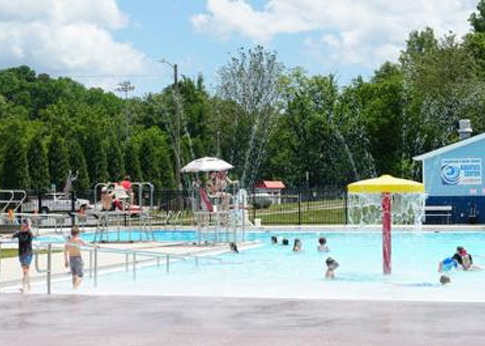 Kids swimming at the Canton pool in Rec Park