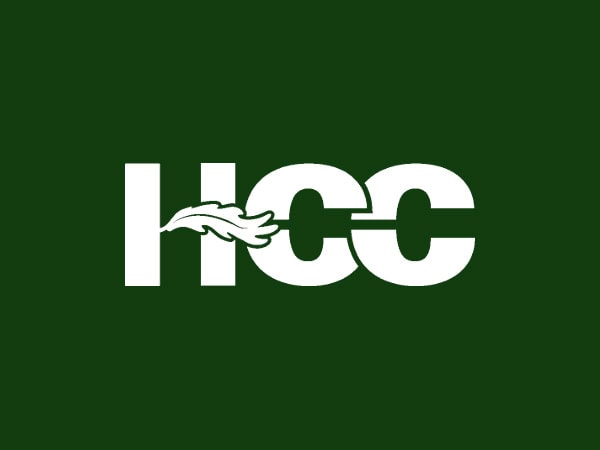White HCC text on a dark green background, with a white oak leaf crossing through the horizontal line of the H and the C letters.