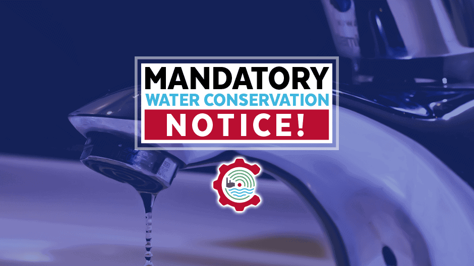 A close-up of a dripping faucet with a sign reading Mandatory Water Conservation Notice! and a water-themed logo below the text.