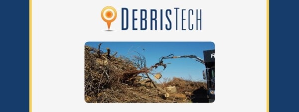 A machine removes large tree branches from a debris pile under a clear blue sky, with the DebrisTech logo displayed above the image.