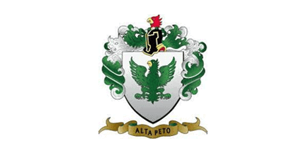 A coat of arms with a green eagle on a white shield, green foliage, a knights helmet above, a bird crest, and a gold banner below reading ALTA PETO.