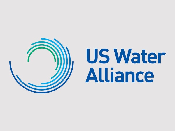 Logo with blue and green circular lines and the text US Water Alliance in blue on a light gray background.