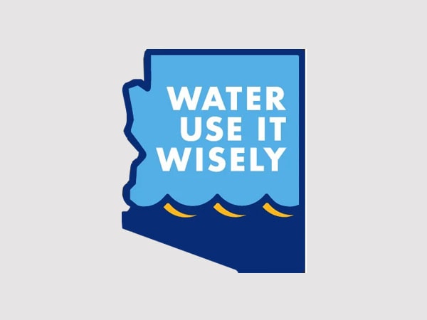 A blue graphic shaped like Arizona with the words WATER USE IT WISELY and stylized yellow waves at the bottom, promoting water conservation.